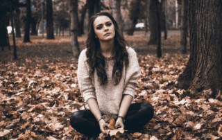 girl depressed in woods