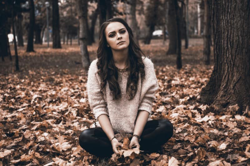 girl depressed in woods